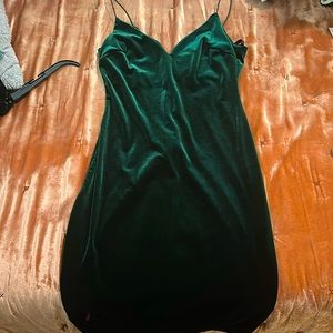 Dark green velvet dress above the knees